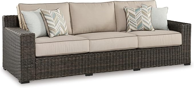 Signature Design by Ashley Coastline Bay Nuvella Weather Resistant Fabric Outdoor Sofa with Cushion and 4 Throw Pillows - Photo 1