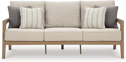 Signature Design by Ashley Hallow Creek Cottage Nuvella Weather Resistant Fabric Outdoor Sofa with Cushion and 4 Throw Pillows, Light Brown & Beige