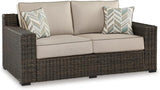 Signature Design by Ashley Coastline Bay Casual Weather Resistant Outdoor Loveseat with Cushion and 2 Throw Pillows - Photo 1