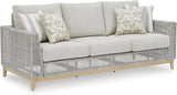Signature Design by Ashley Seton Creek Cottage Nuvella Weather Resistant Fabric Outdoor Sofa with Cushion and 4 Throw - Photo 1